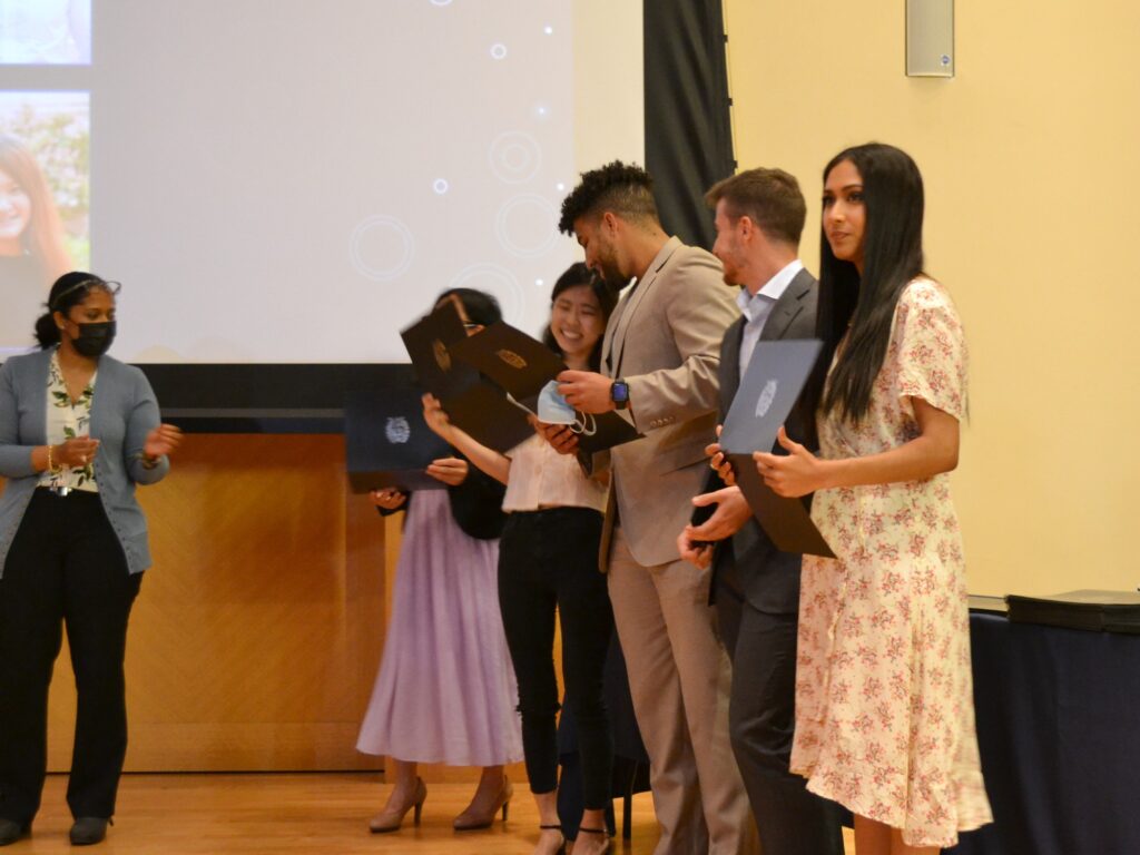 Members of the Biotechnology program's graduating Class of 2022 stand together during the program gala