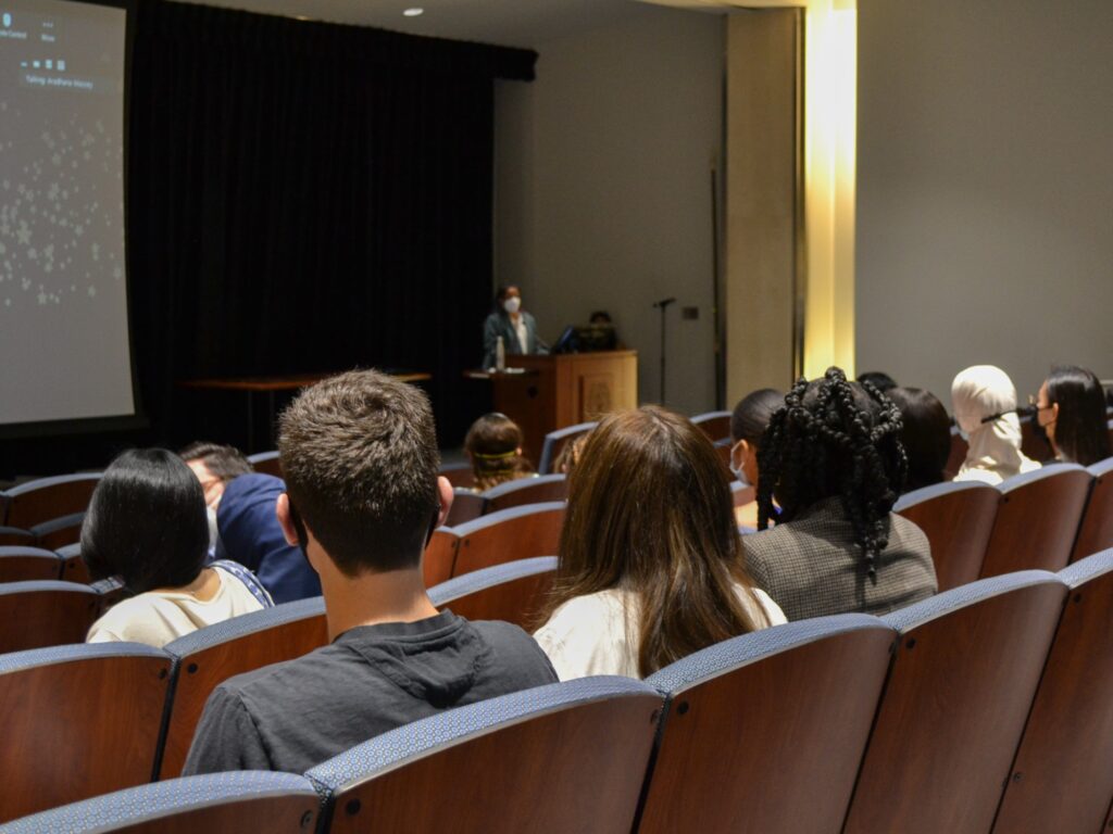 Systems Medicine graduates listen to Dr. Sona Vasudevan during the program gala