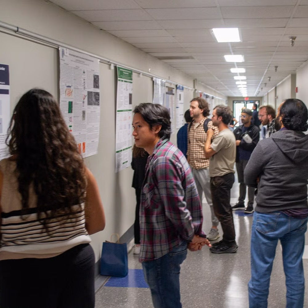 Doctoral students discuss their research during poster presentations at Student Research Day 2023