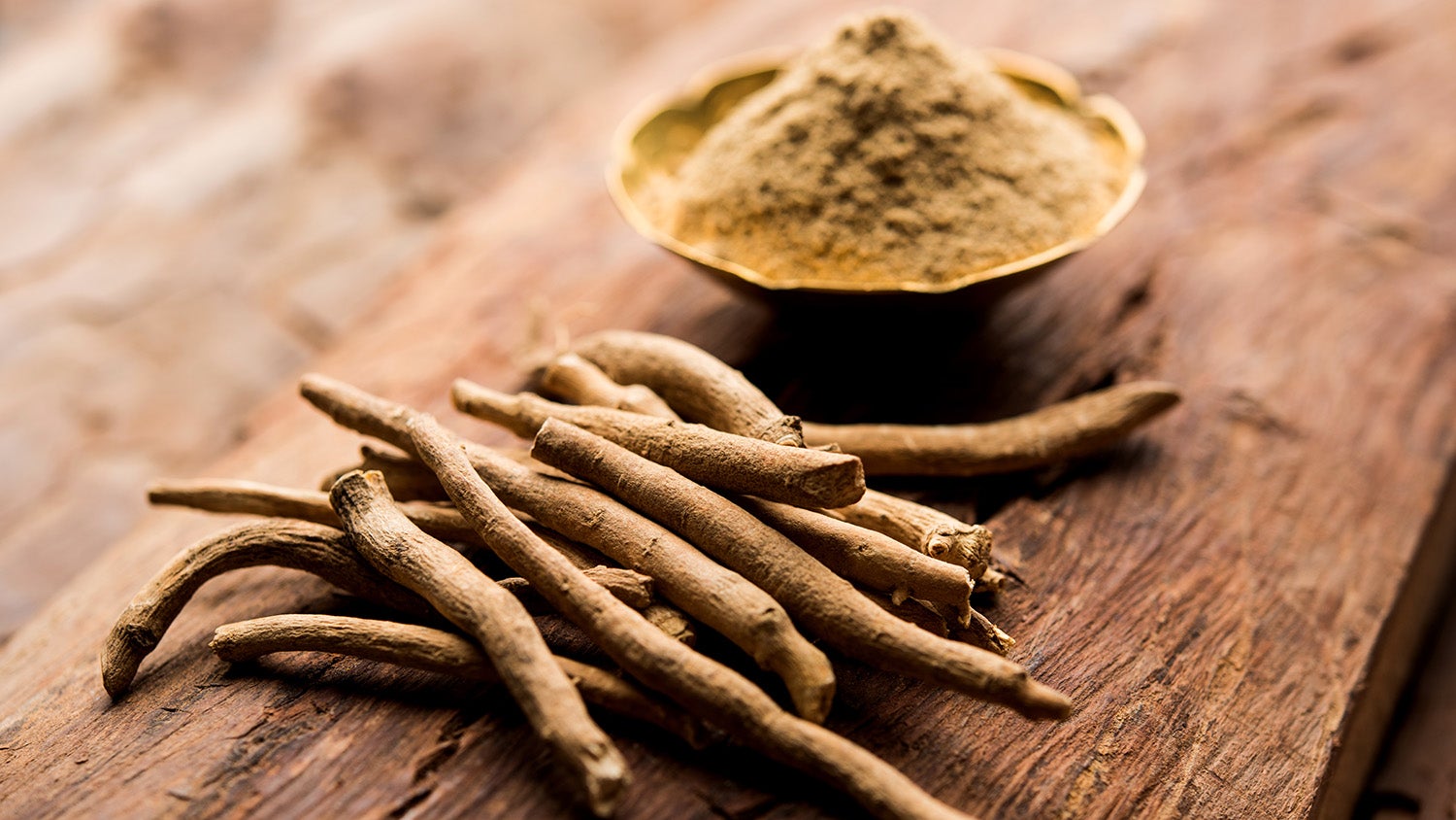 Ashwagandha roots and powder on a table