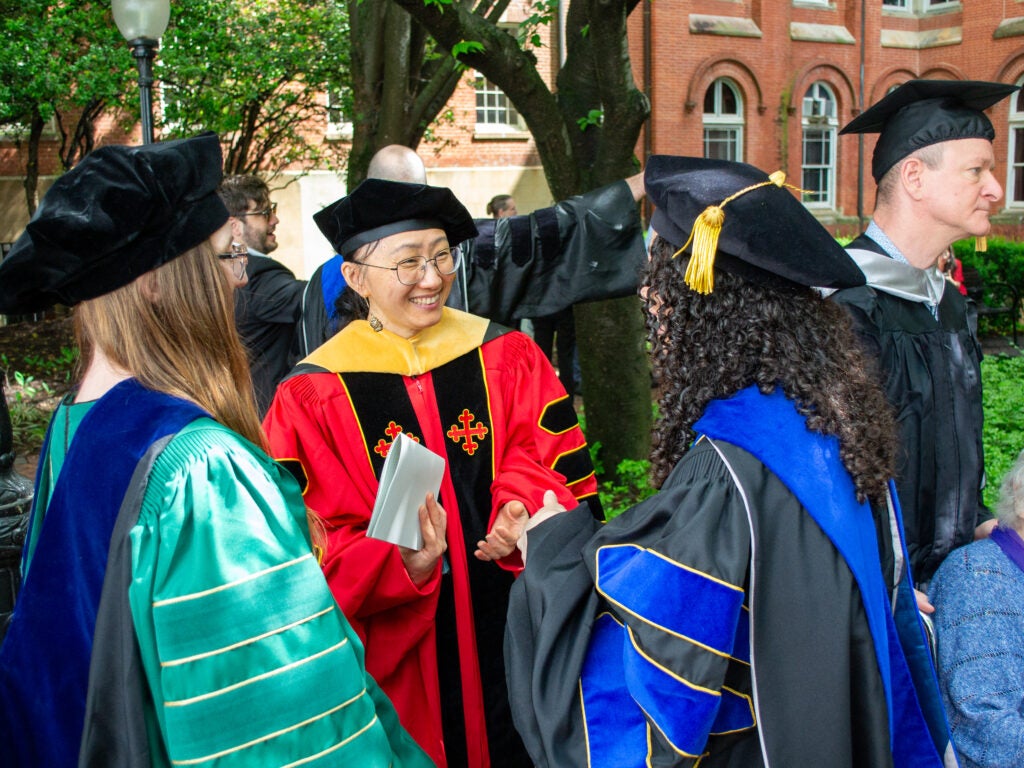 Ph.D. graduate and faculty at the Doctoral Hooding Reception