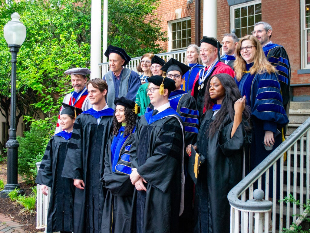 Ph.D. graduates and faculty at the Doctoral Hooding Reception