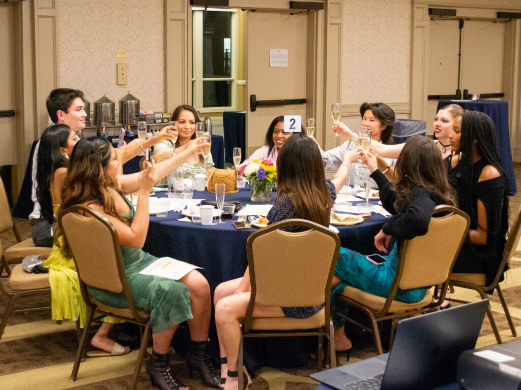 Students toasting at the Integrative Medicine & Health Sciences program gala