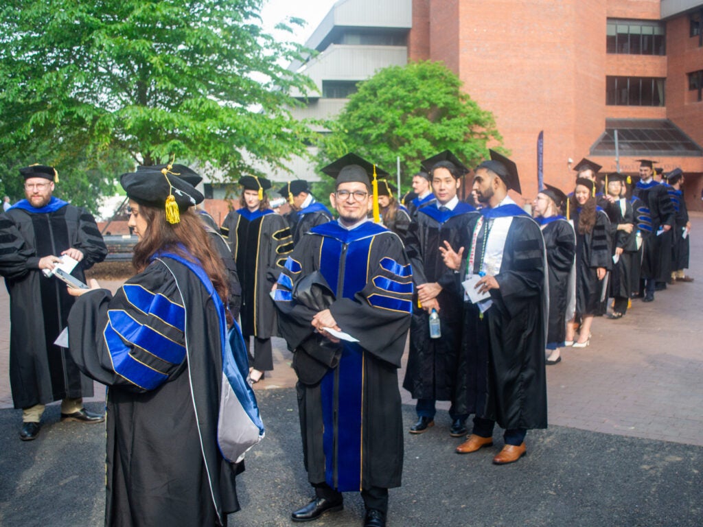 Ph.D. graduates at Commencement line-up