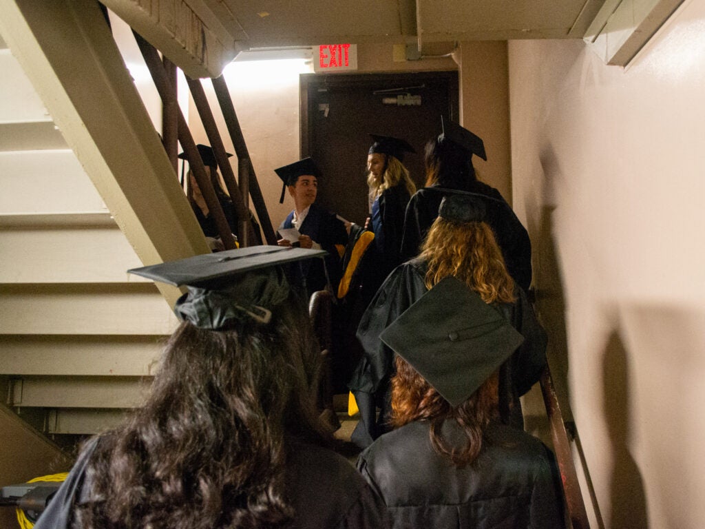 Graduates climb the ICC stairs at Commencement line-up