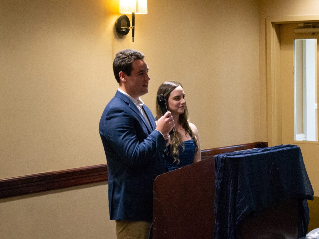 Students address attendees at the Systems Medicine program gala