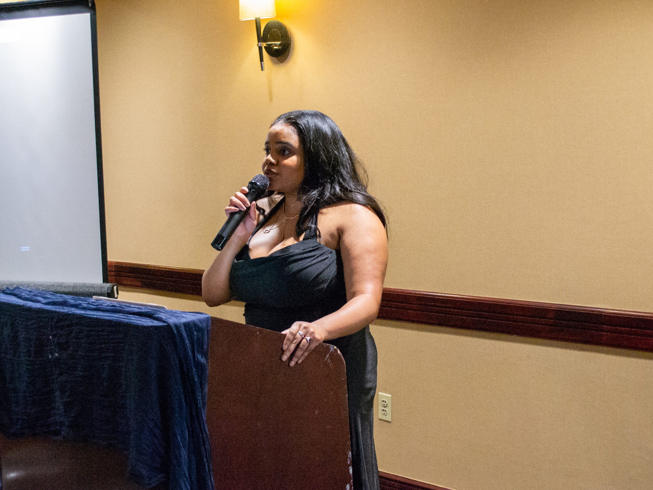 A student sings to attendees at the Systems Medicine program gala