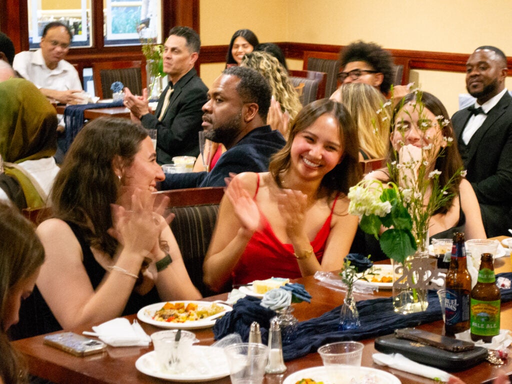 A student celebrates at the Systems Medicine program gala