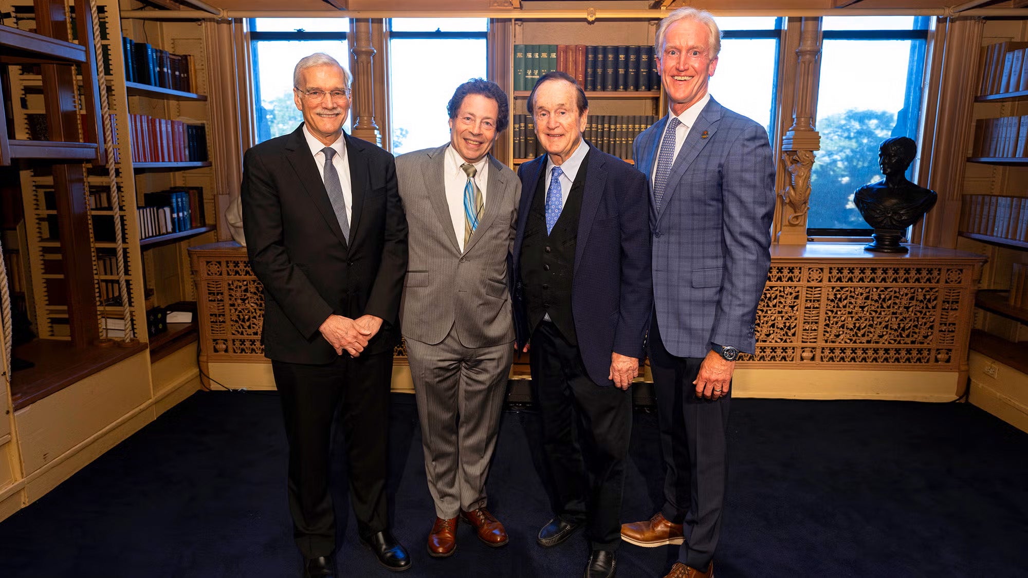 (Pictured from right) Kevin Reilly (B'91, P'26, P'27), vice chair of the Hyundai Hope on Wheels board of directors, and his father, Don, founder of the charitable organization, stand with the inaugural holder of the Hyundai Hope on Wheels Endowed Chair in Pediatric Oncology, Jeffrey A. Toretsky, MD, and Georgetown Interim President Robert M. Groves, PhD.