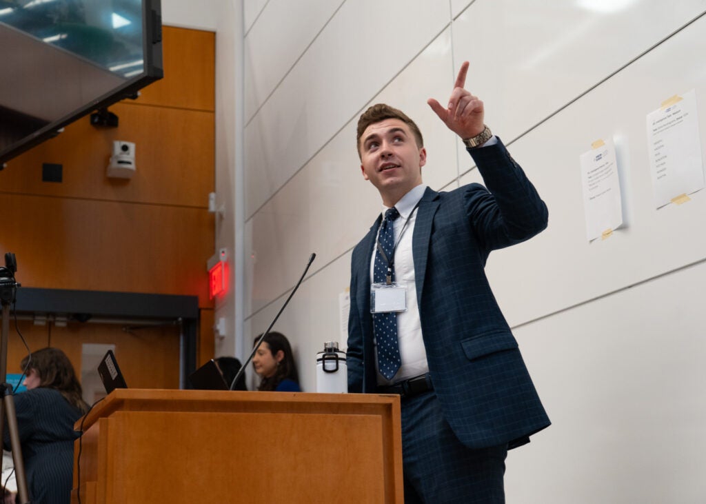 Medium shot of Curtis Hoffmann pointing to the audience