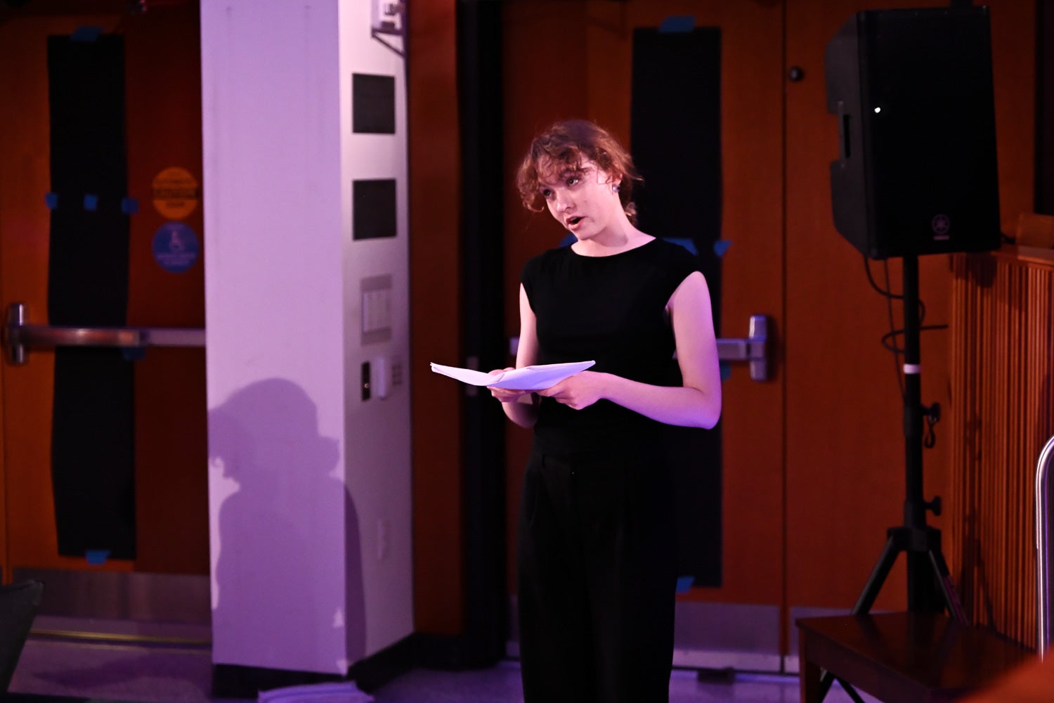 Ena Sullivan reads from her script on the Harvey Amphitheater stage