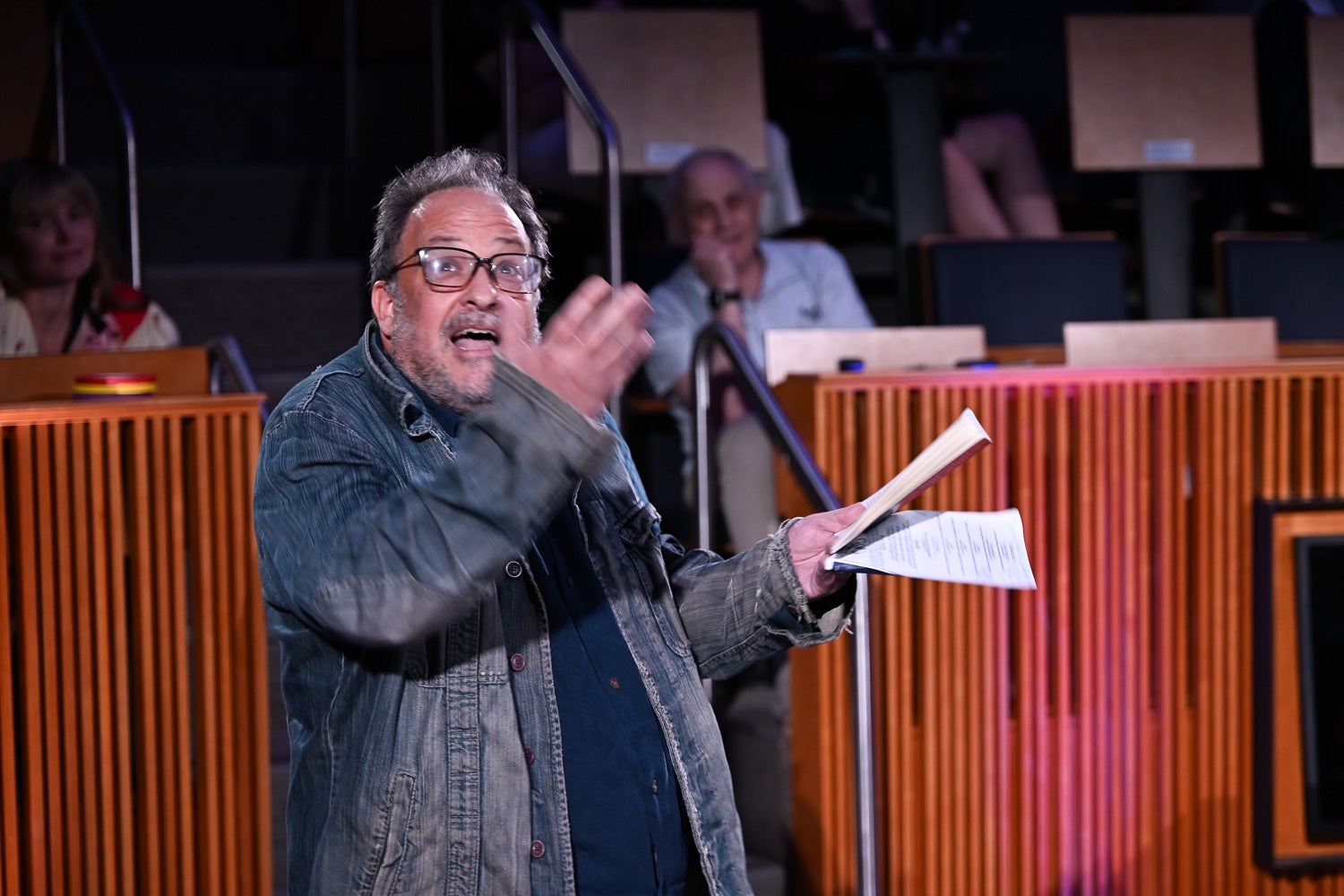 Derek Goldman, performing arts professor, gesticulates while reading