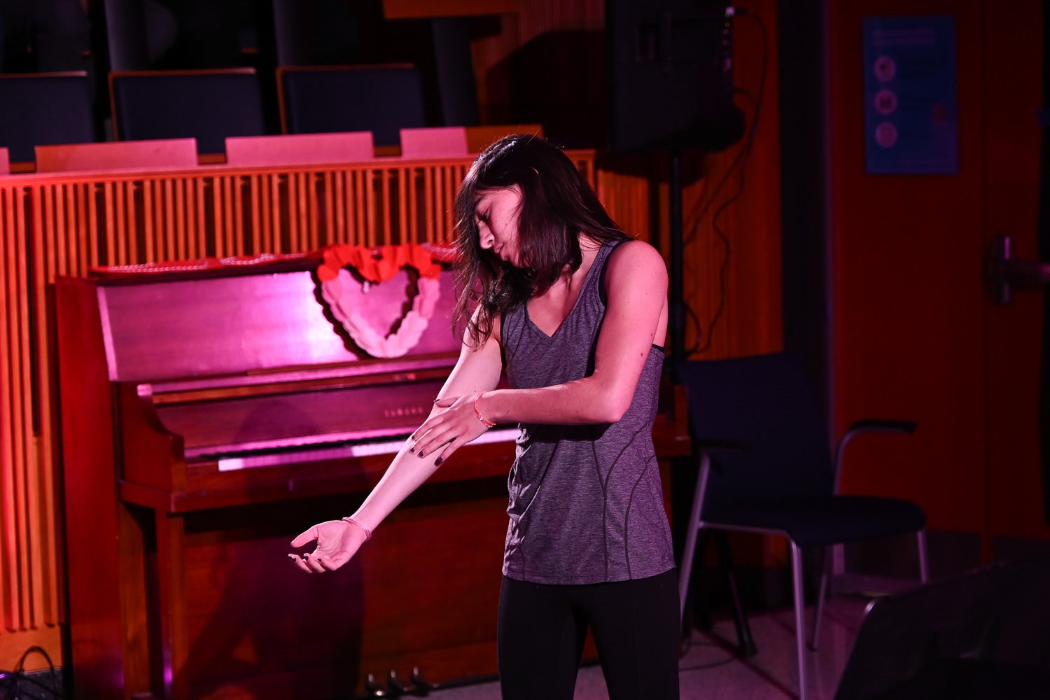 Undergraduate student Raquel Silva dances on the Harvey Amphitheater stage