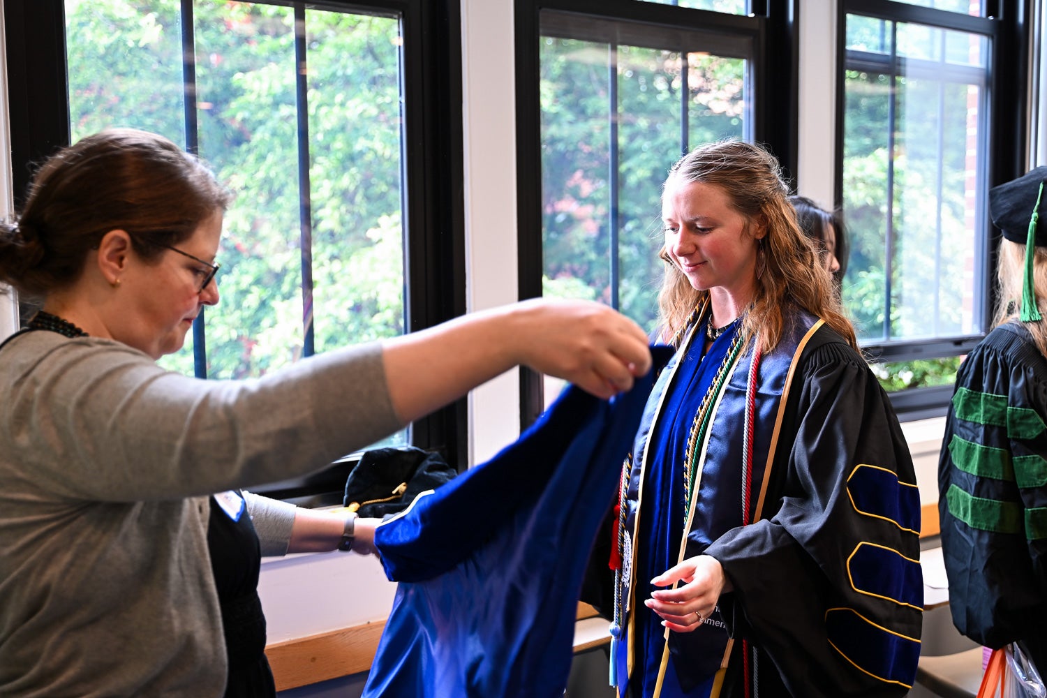 A BGE Ph.D. graduate in the line-up room before the School of Medicine Commencement ceremony