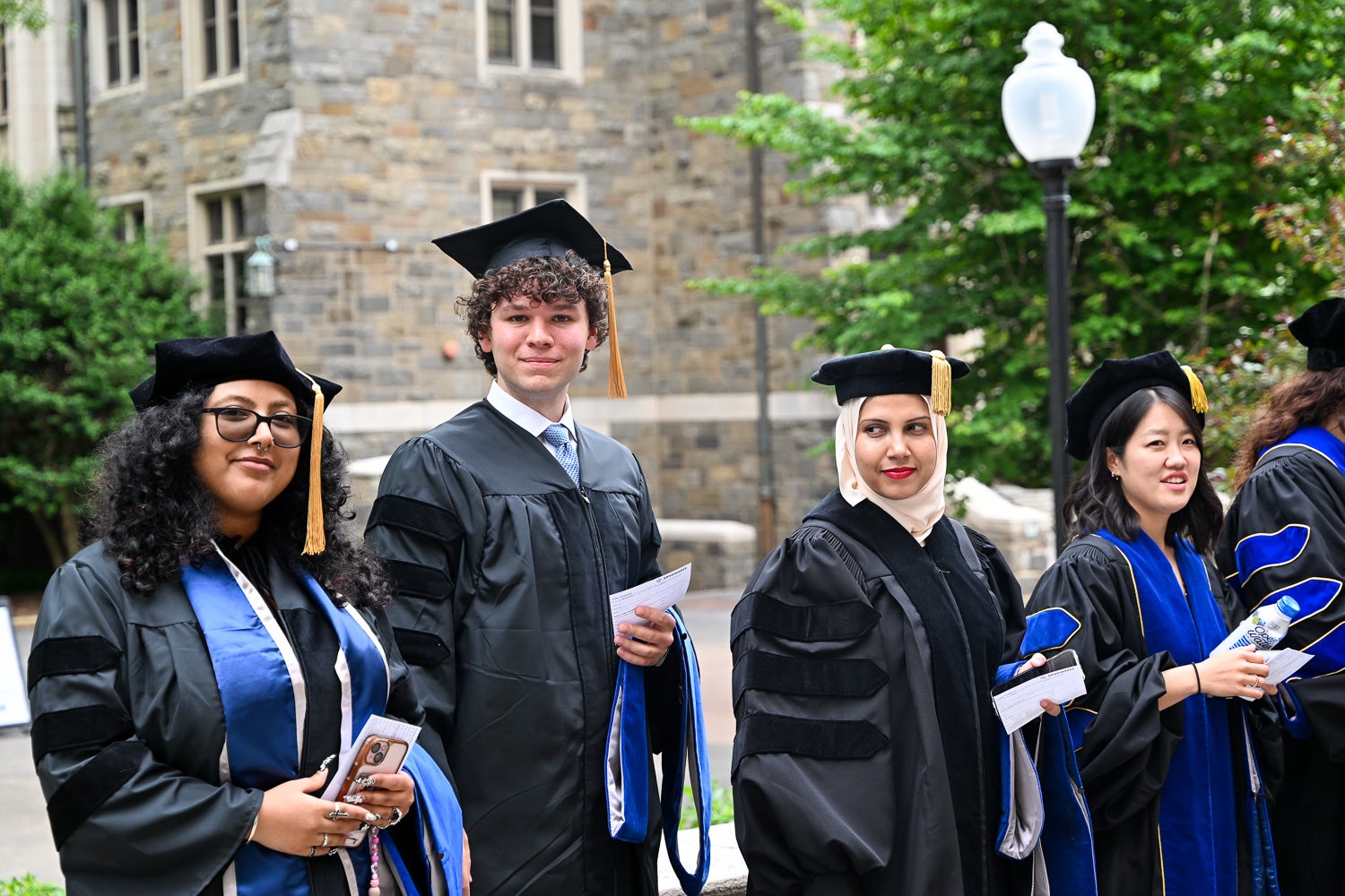 BGE Ph.D. graduates on White-Gravenor Esplanade before the School of Medicine Commencement ceremony