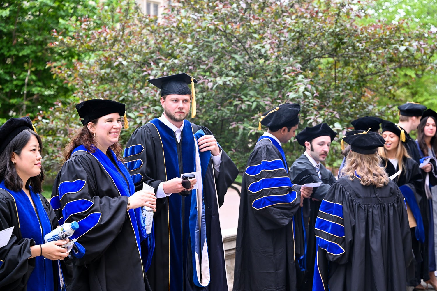 BGE Ph.D. graduates on White-Gravenor Esplanade before the School of Medicine Commencement ceremony