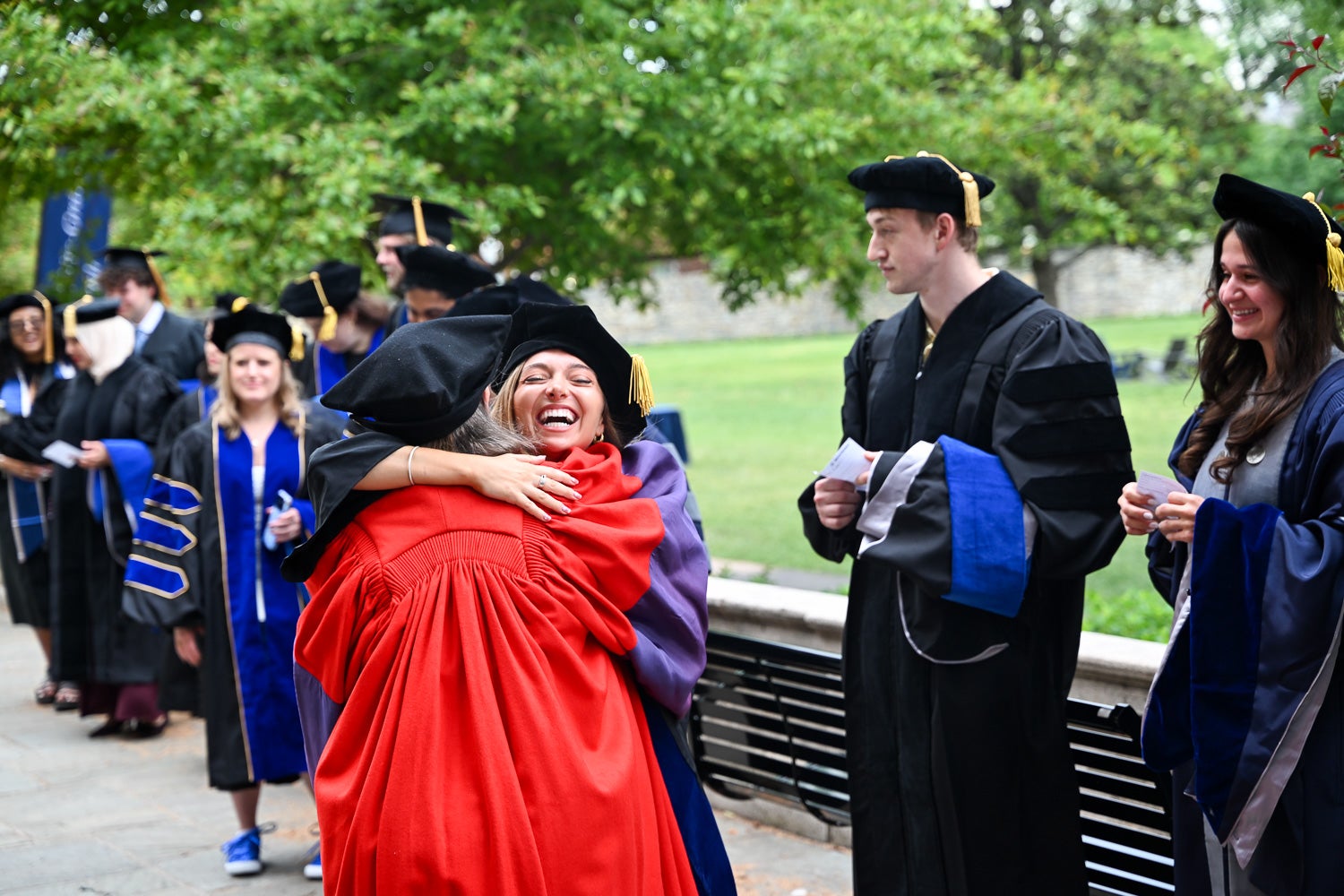 BGE Ph.D. graduates on White-Gravenor Esplanade before the School of Medicine Commencement ceremony