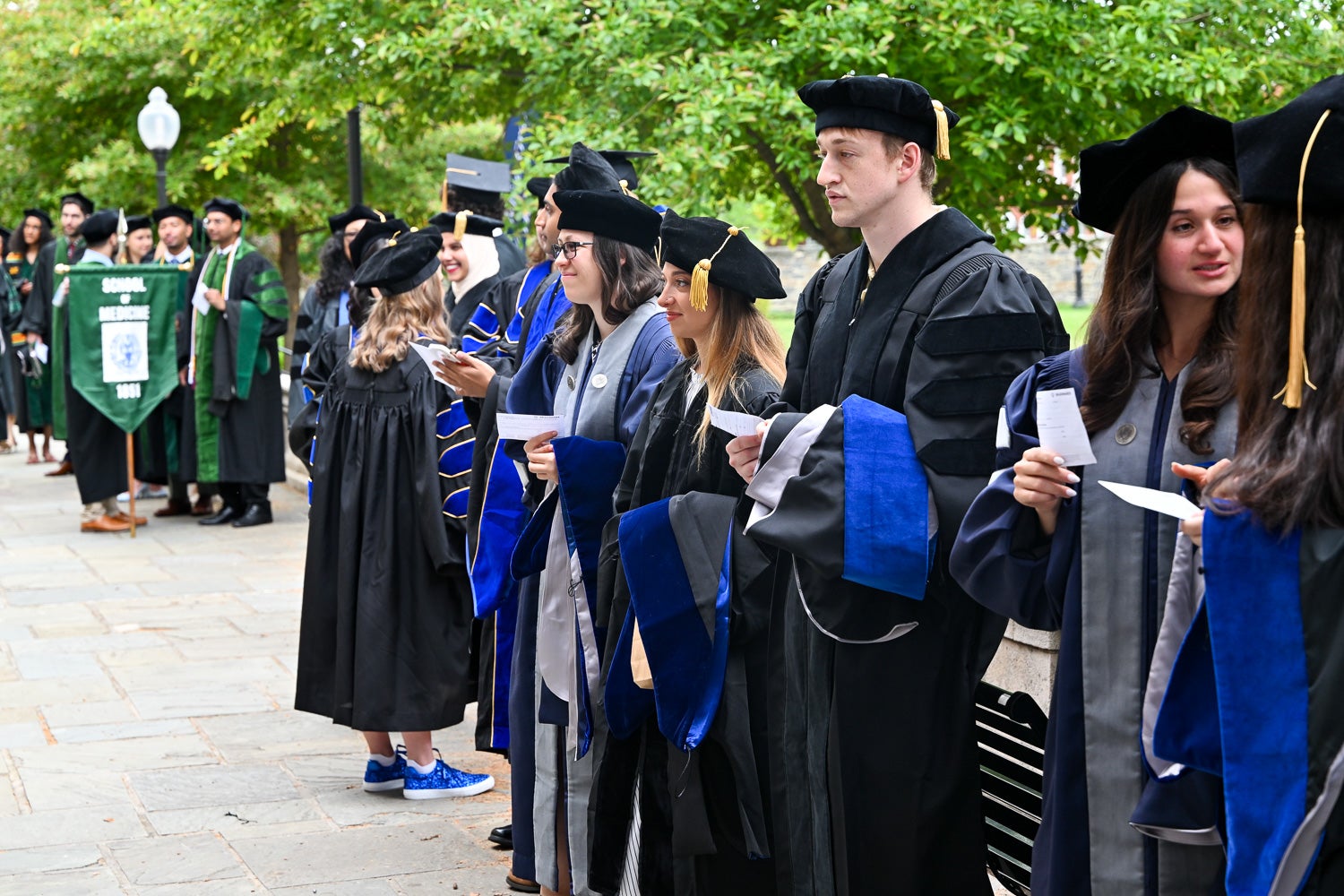 BGE Ph.D. graduates on White-Gravenor Esplanade before the School of Medicine Commencement ceremony