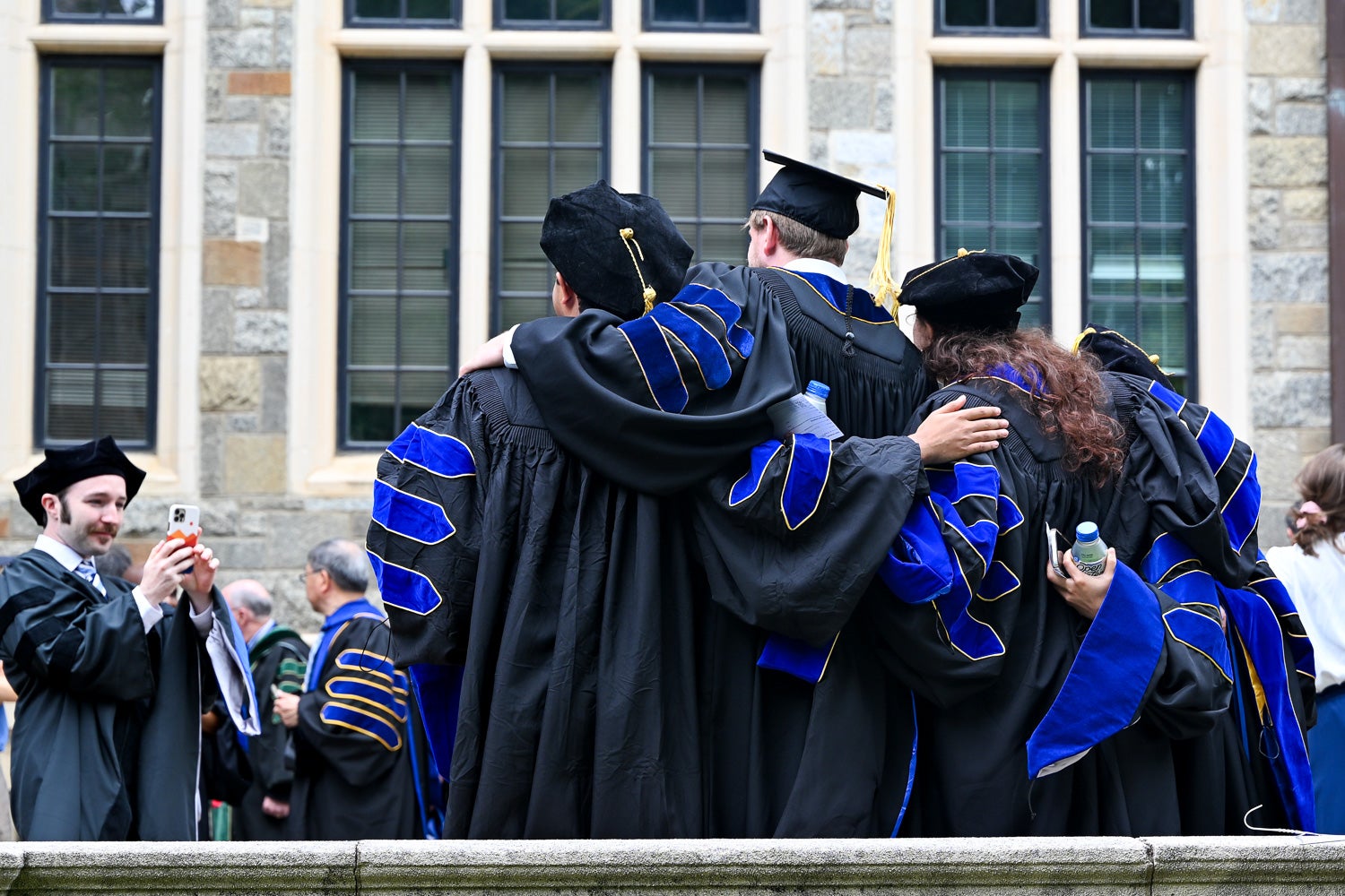 BGE Ph.D. graduates on White-Gravenor Esplanade before the School of Medicine Commencement ceremony