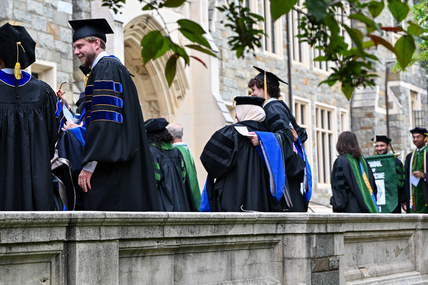 BGE Ph.D. graduates on White-Gravenor Esplanade before the School of Medicine Commencement ceremony