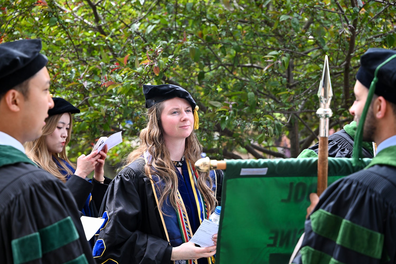 BGE Ph.D. graduates on White-Gravenor Esplanade before the School of Medicine Commencement ceremony