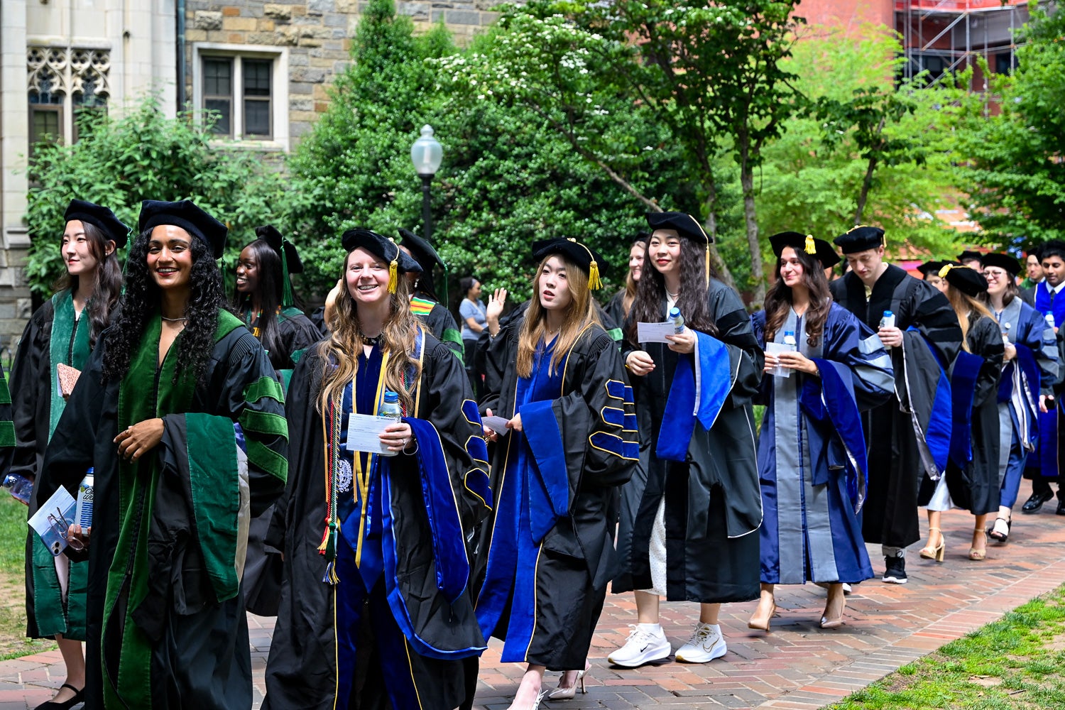 BGE Ph.D. graduates process across Copley Lawn to Healy Lawn for the School of Medicine Commencement ceremony