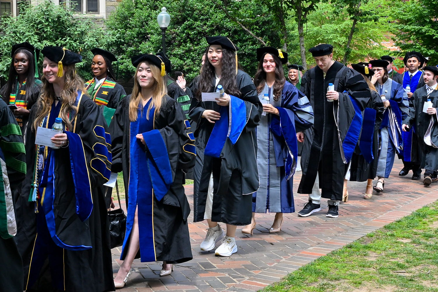 BGE Ph.D. graduates process across Copley Lawn to Healy Lawn for the School of Medicine Commencement ceremony