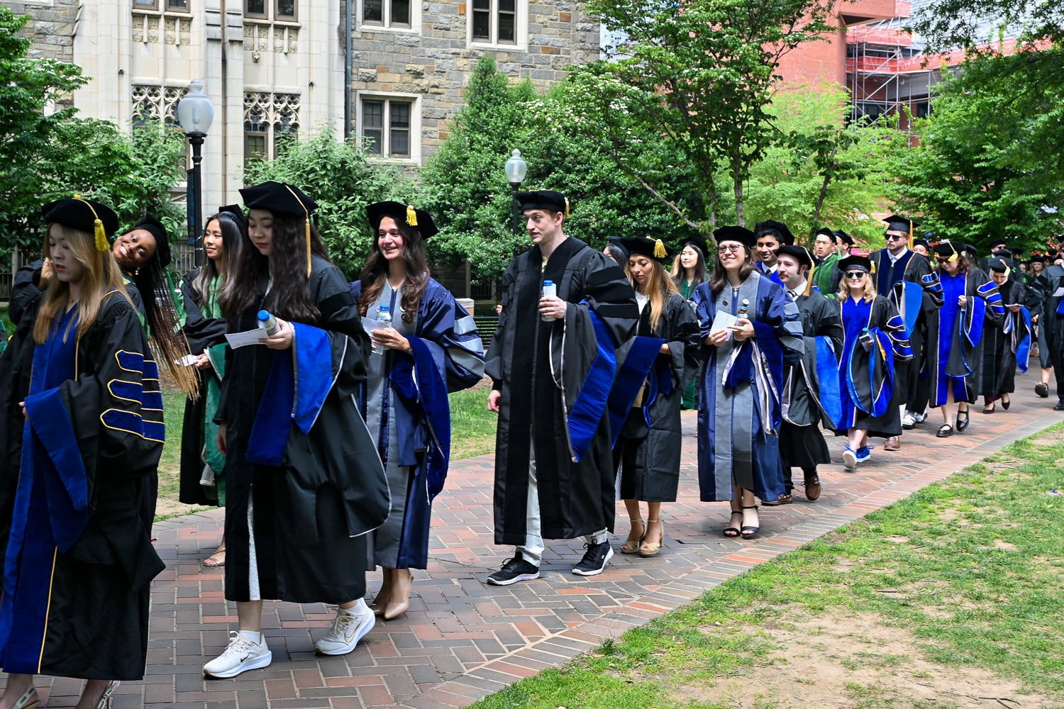 BGE Ph.D. graduates process across Copley Lawn to Healy Lawn for the School of Medicine Commencement ceremony