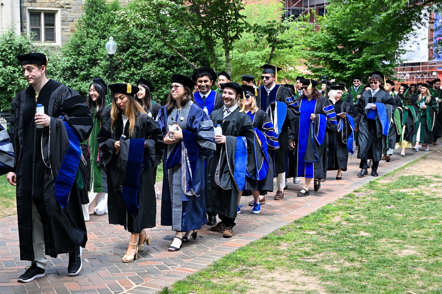 BGE Ph.D. graduates process across Copley Lawn to Healy Lawn for the School of Medicine Commencement ceremony