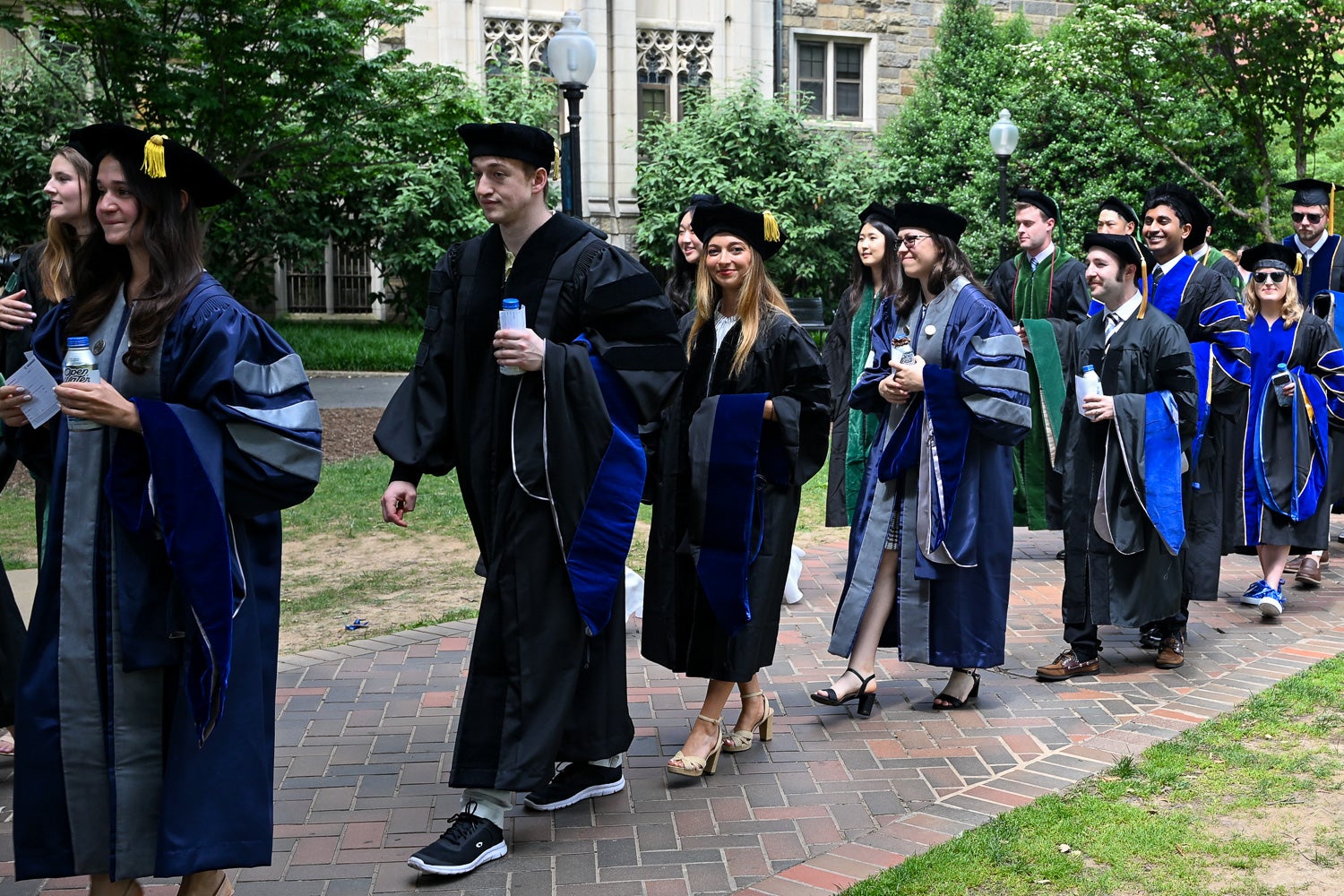 BGE Ph.D. graduates process across Copley Lawn to Healy Lawn for the School of Medicine Commencement ceremony