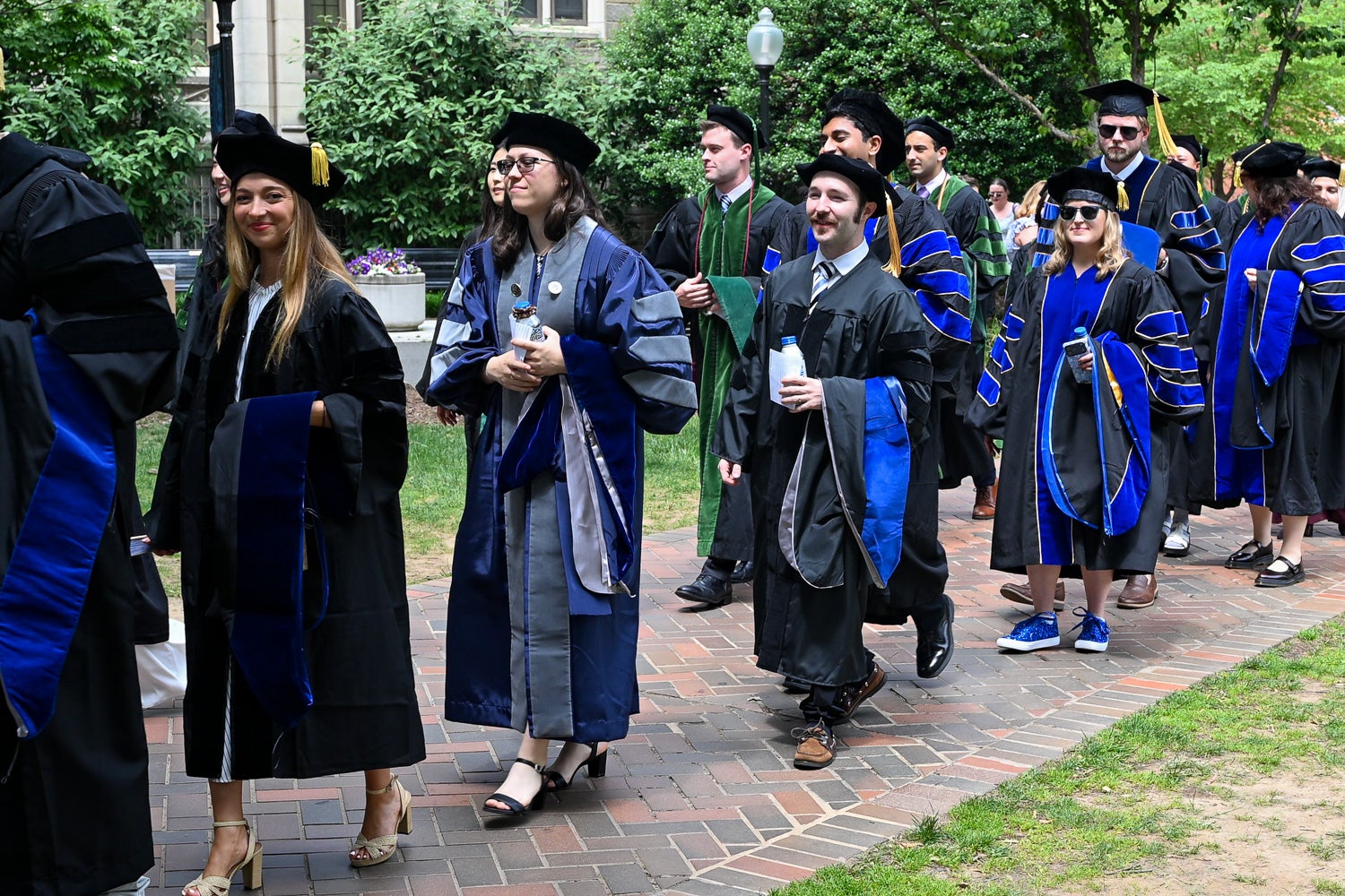 BGE Ph.D. graduates process across Copley Lawn to Healy Lawn for the School of Medicine Commencement ceremony