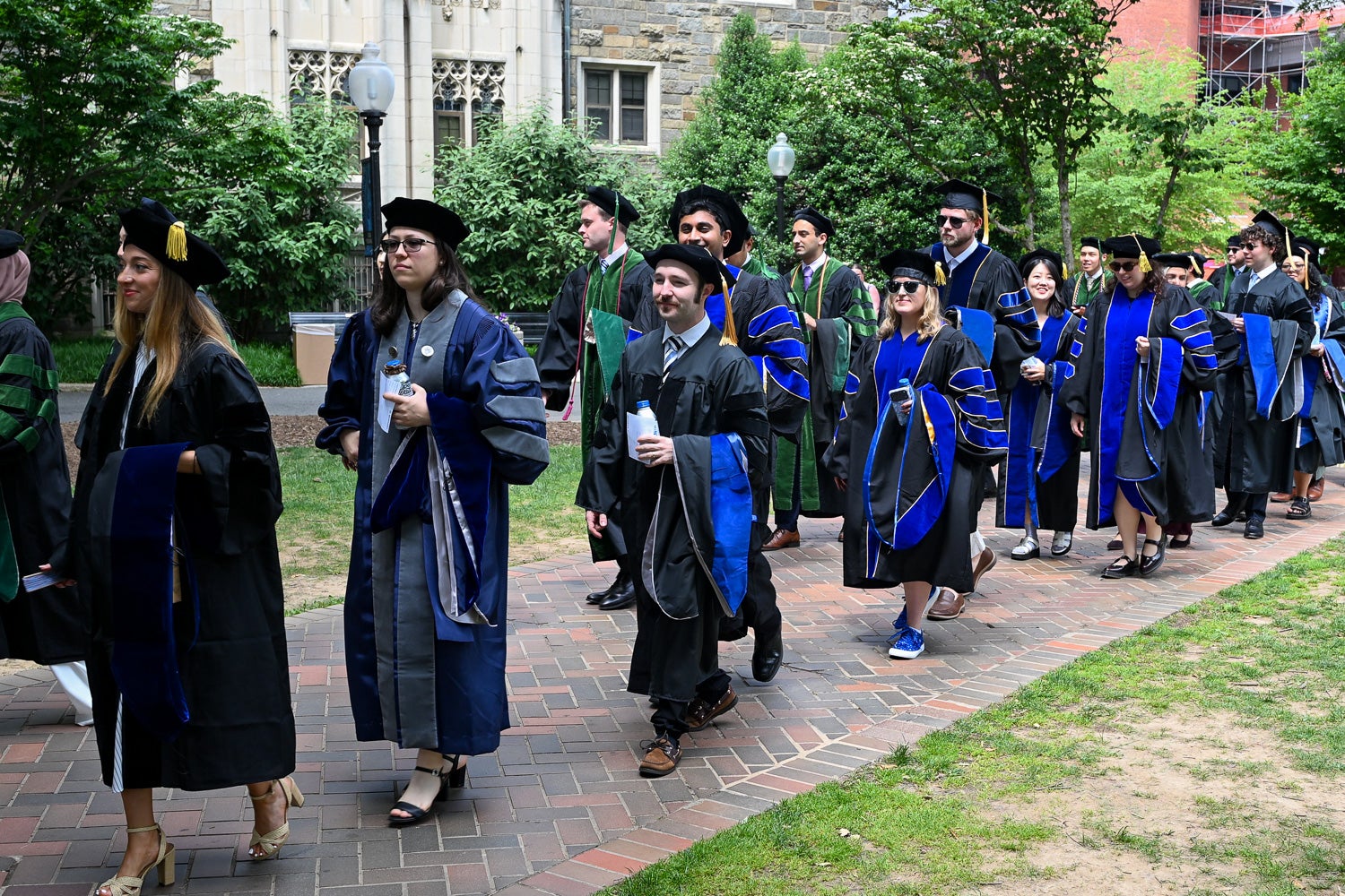 BGE Ph.D. graduates process across Copley Lawn to Healy Lawn for the School of Medicine Commencement ceremony