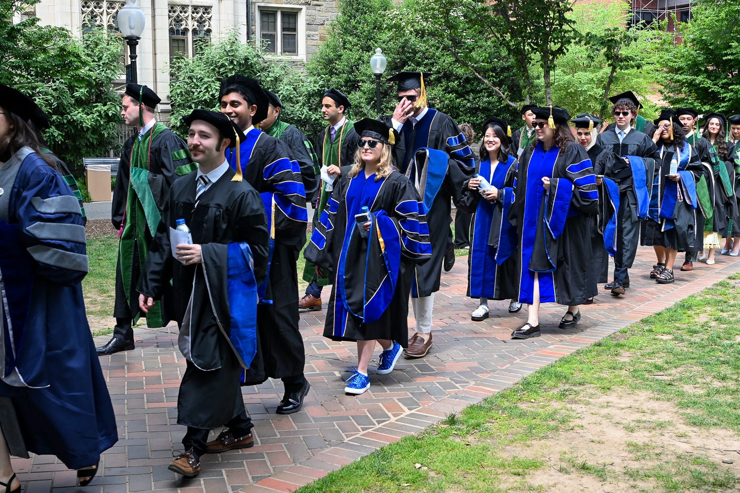 BGE Ph.D. graduates process across Copley Lawn to Healy Lawn for the School of Medicine Commencement ceremony
