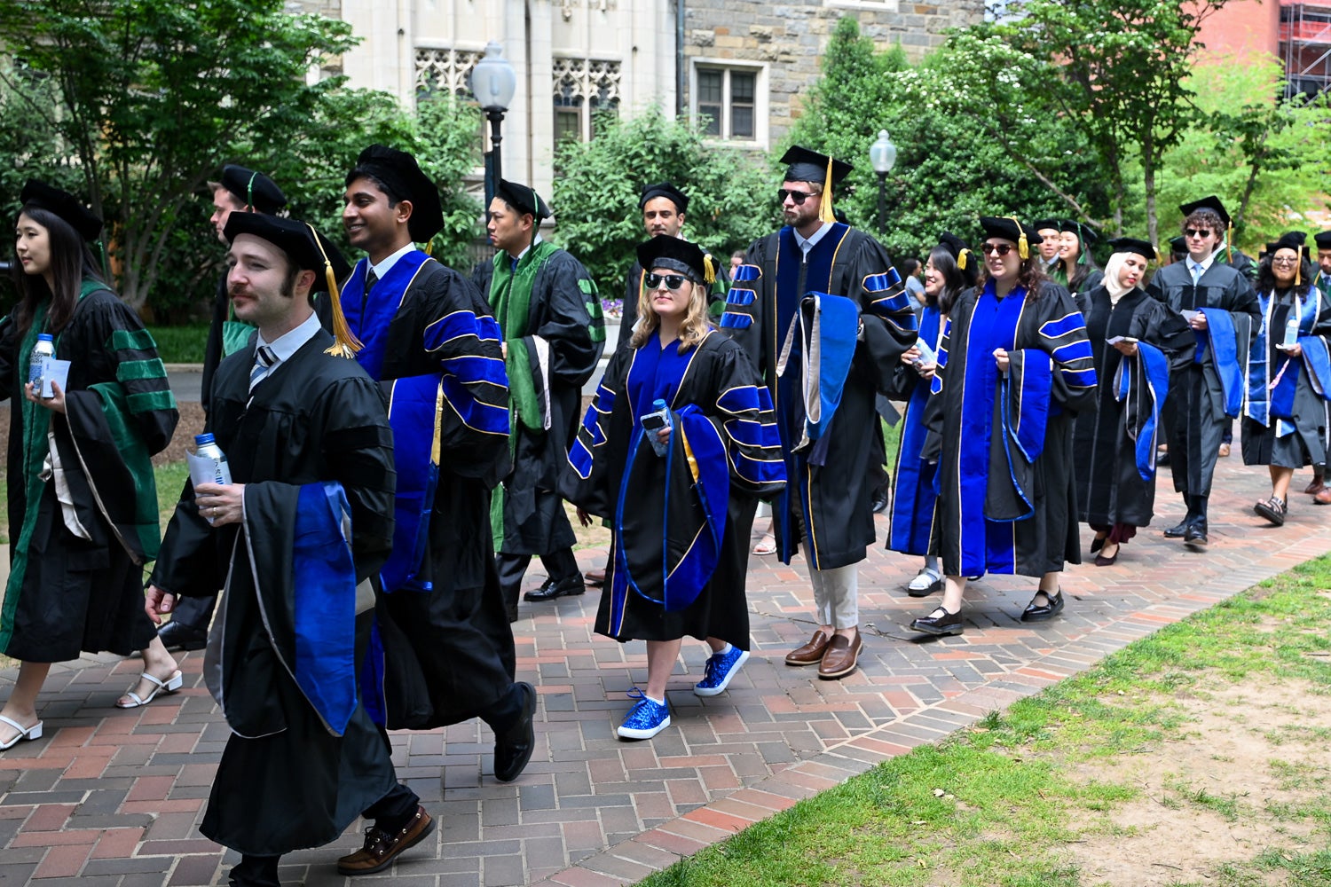 BGE Ph.D. graduates process across Copley Lawn to Healy Lawn for the School of Medicine Commencement ceremony