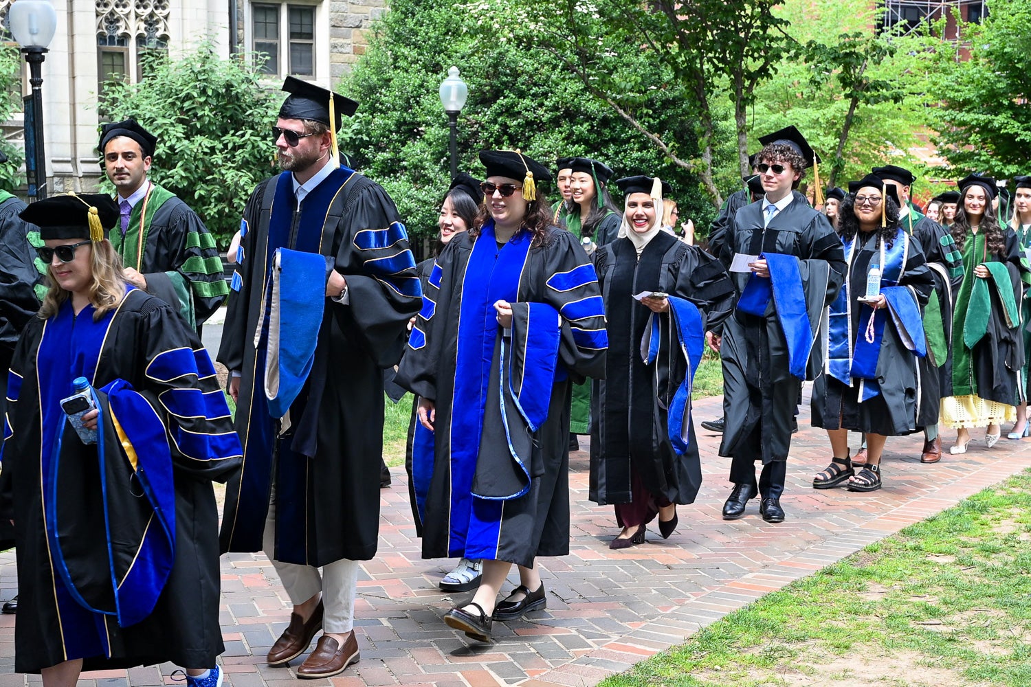 BGE Ph.D. graduates process across Copley Lawn to Healy Lawn for the School of Medicine Commencement ceremony