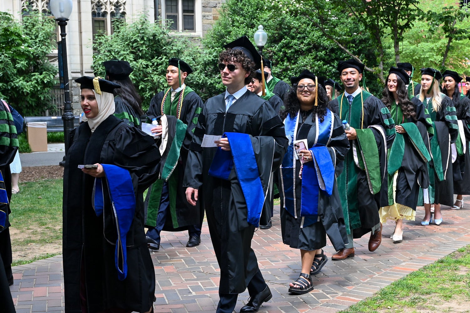BGE Ph.D. graduates process across Copley Lawn to Healy Lawn for the School of Medicine Commencement ceremony