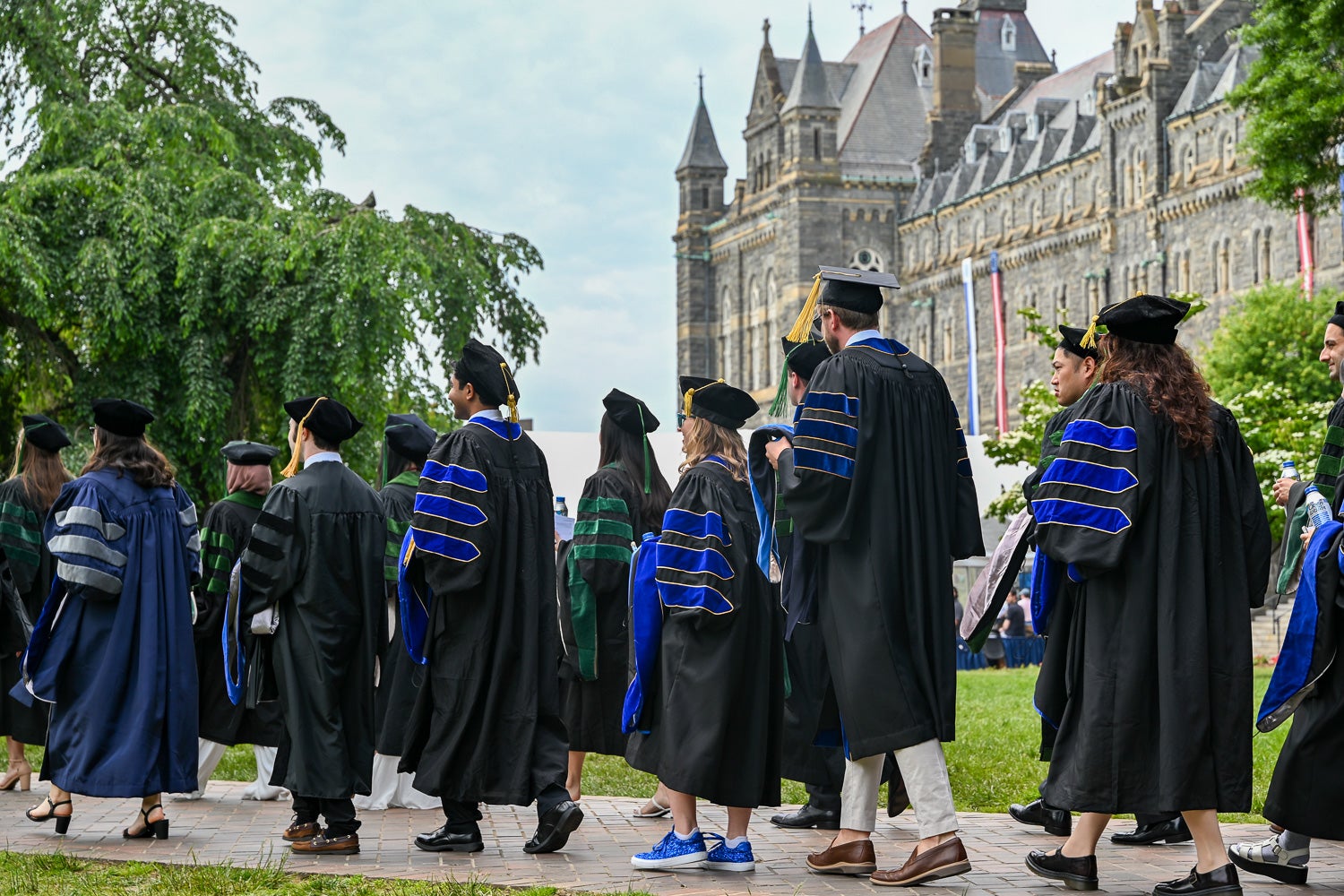 BGE Ph.D. graduates process across Copley Lawn to Healy Lawn for the School of Medicine Commencement ceremony