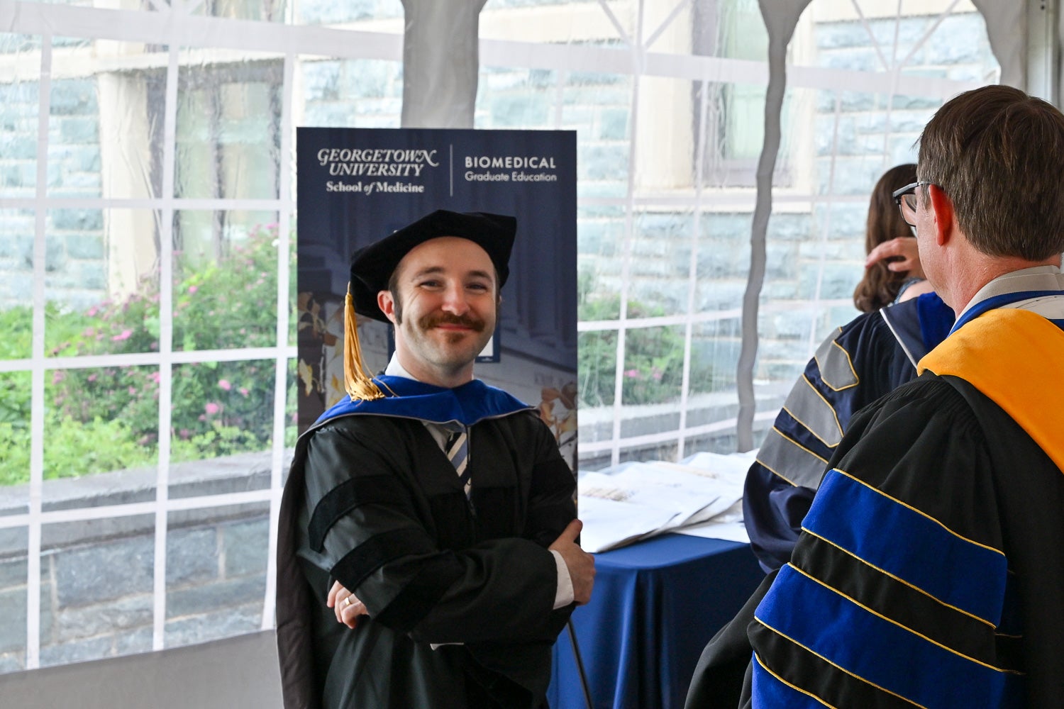 A graduate smiles for the camera at the BGE Ph.D. Reception