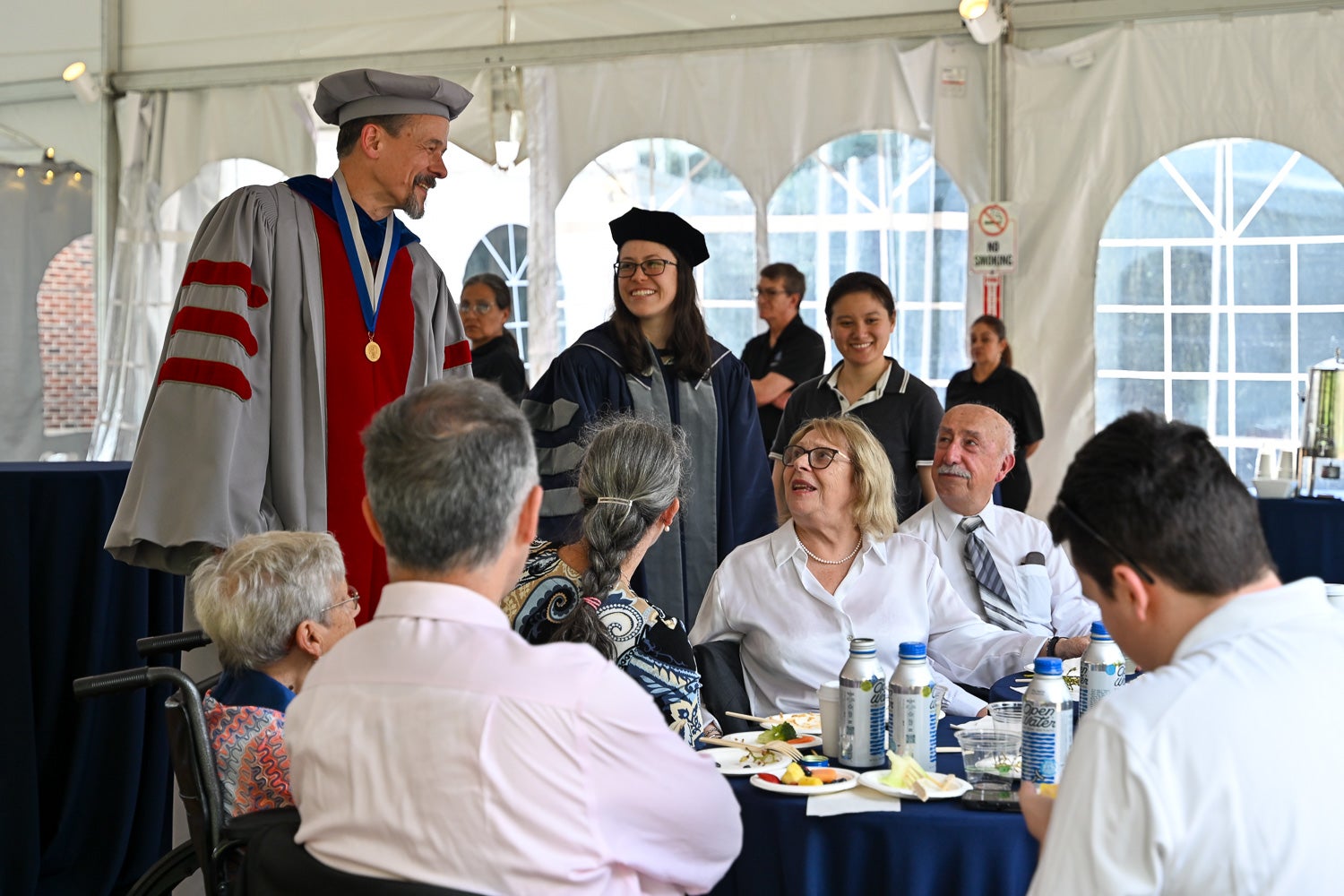 Attendees talk and laugh at the BGE Ph.D. Reception