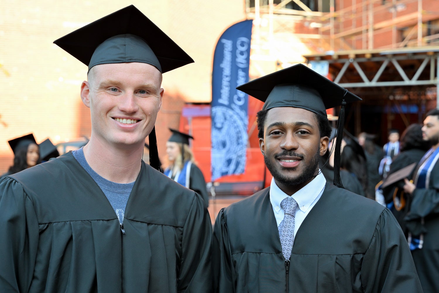 Graduates in commencement regalia pose together on Red Square before the ceremony