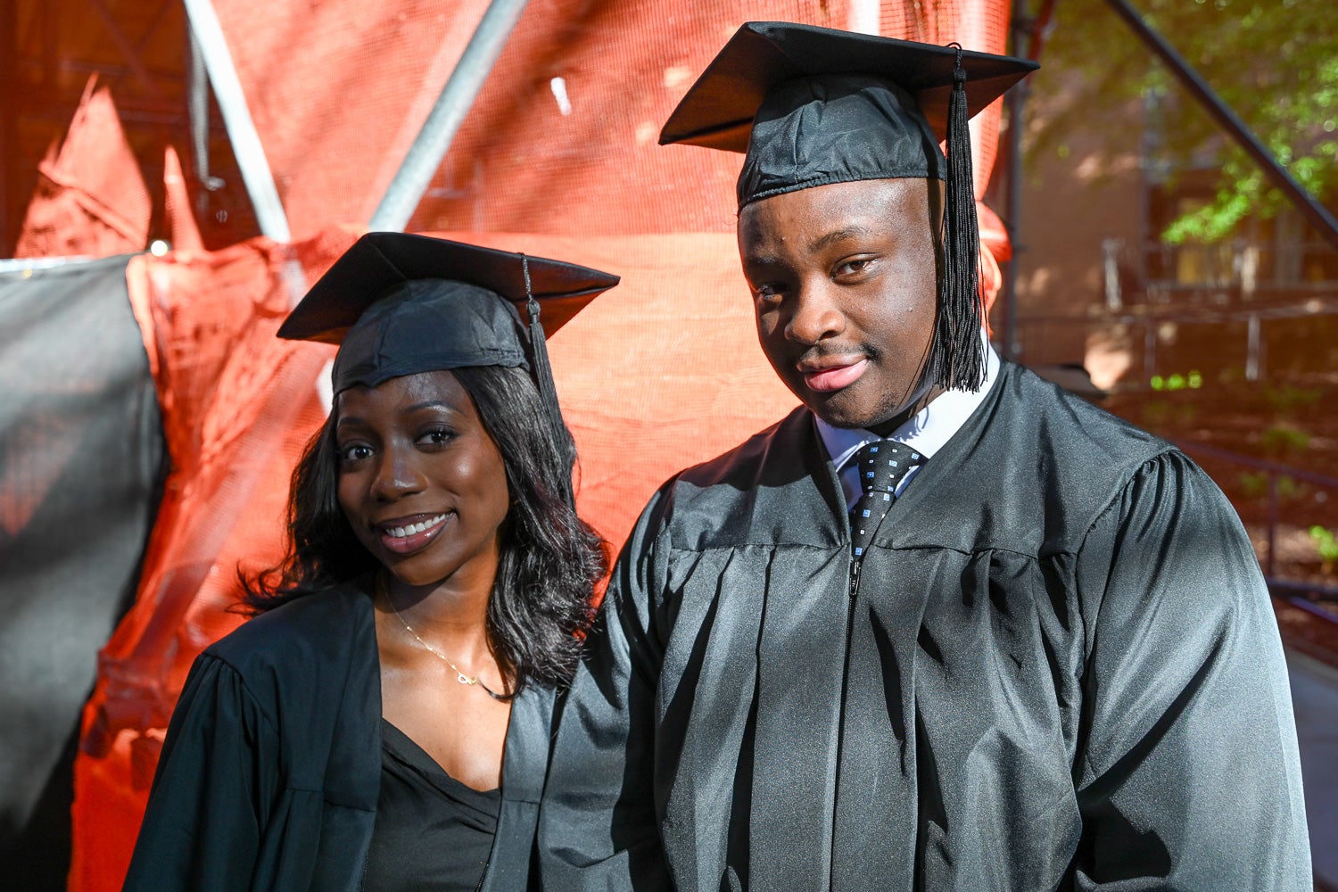 Graduates in commencement regalia pose together on Red Square before the ceremony