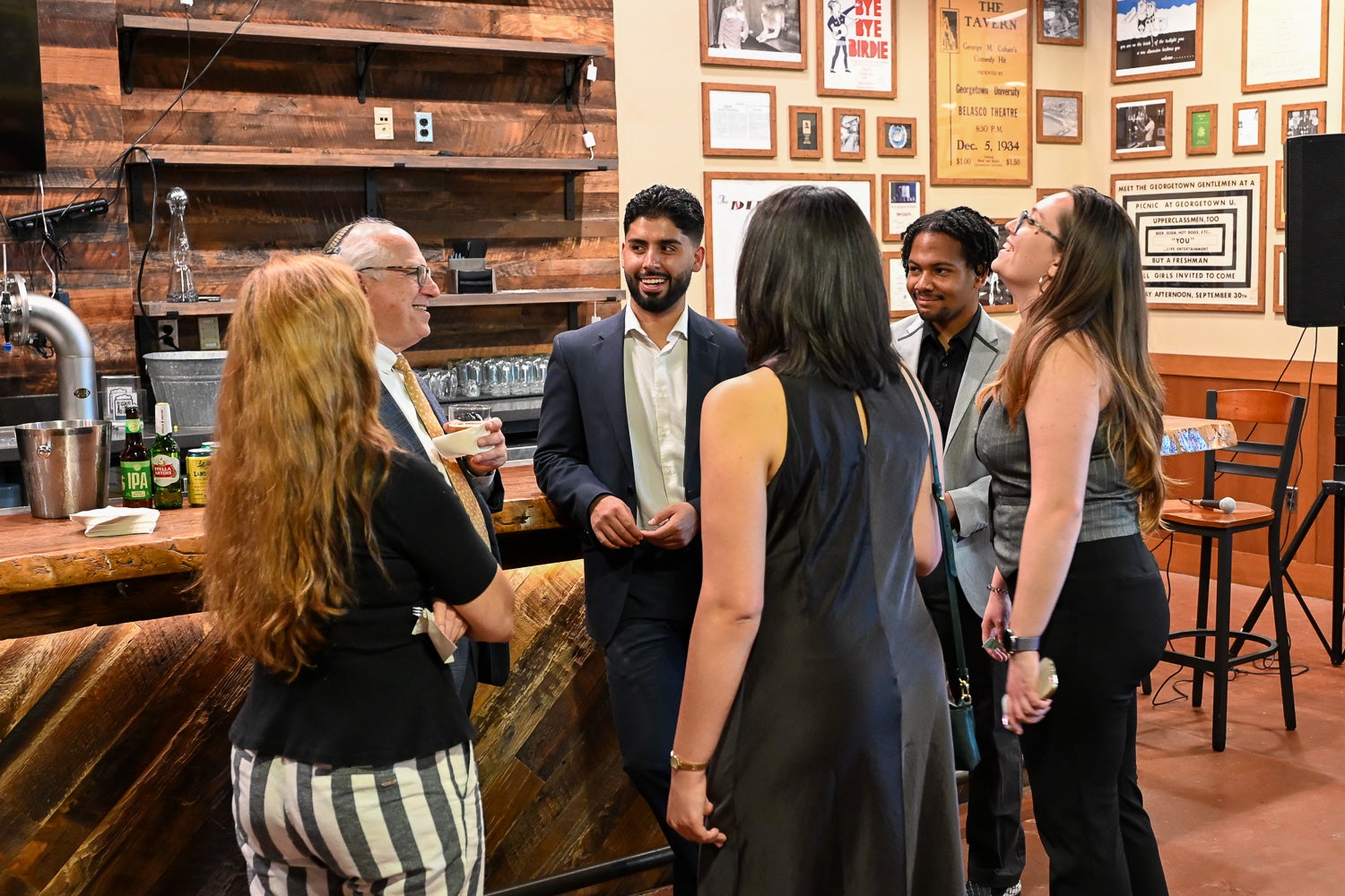Students and faculty talk at the Integrative Medicine & Health Sciences Pre-Commencement Dinner