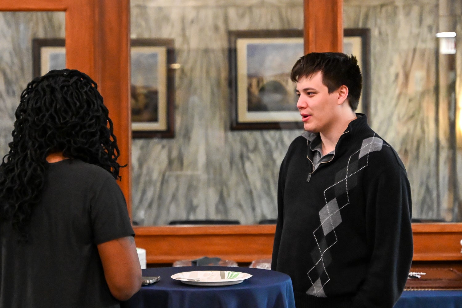Attendees talk at the Department of Microbiology & Immunology Reception