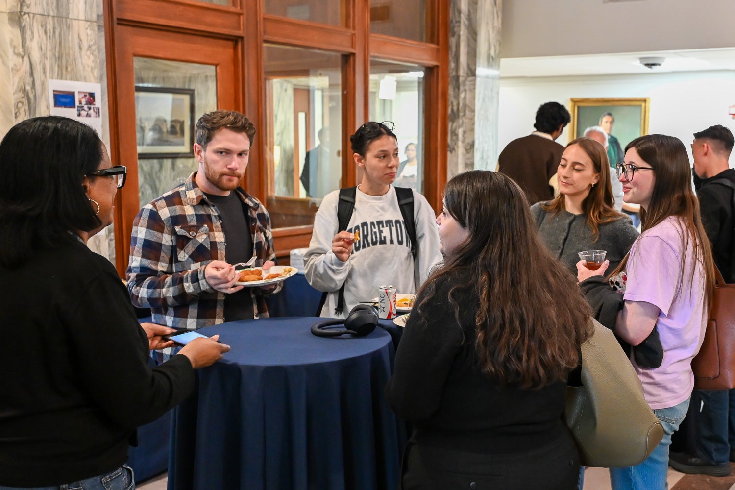 Attendees talk at the Department of Microbiology & Immunology Reception