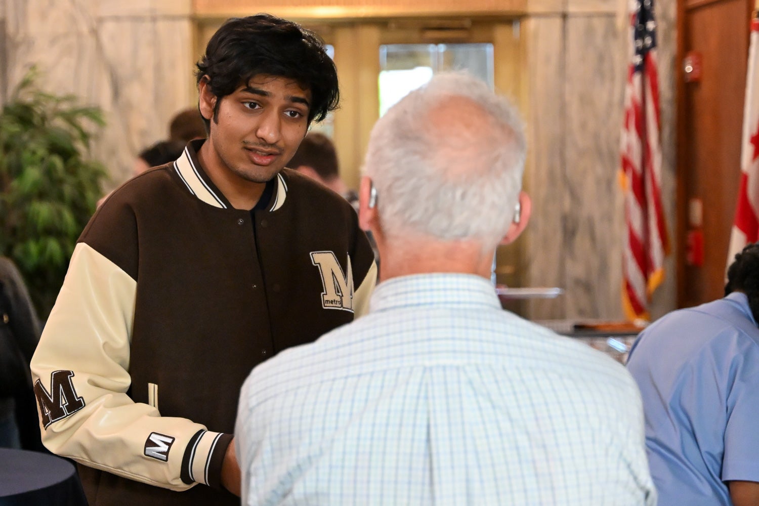 Attendees talk at the Department of Microbiology & Immunology Reception