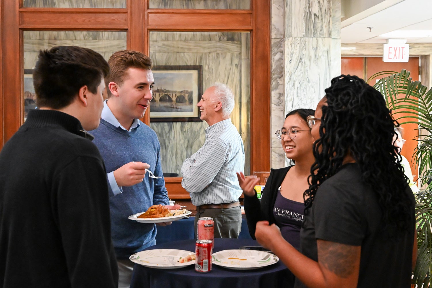 Attendees talk at the Department of Microbiology & Immunology Reception