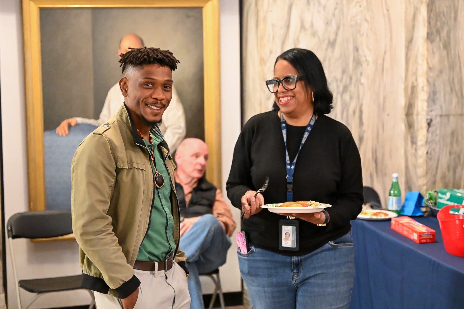 A student and professor talk at the Department of Microbiology & Immunology Reception
