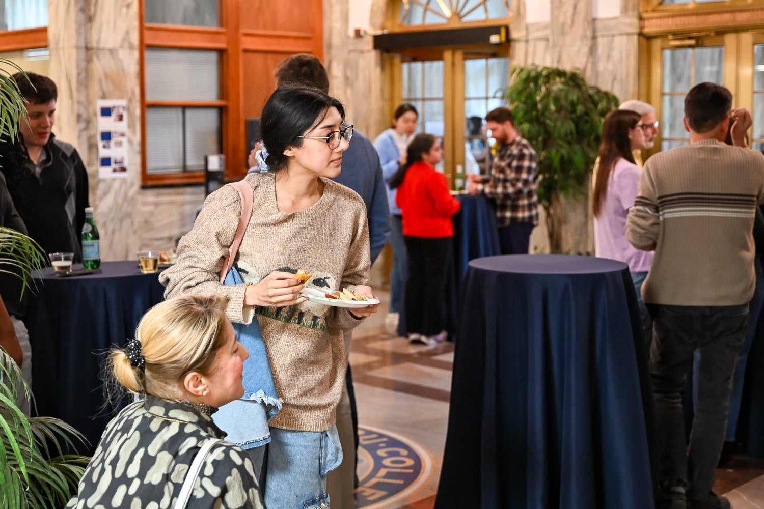 Attendees talk at the Department of Microbiology & Immunology Reception