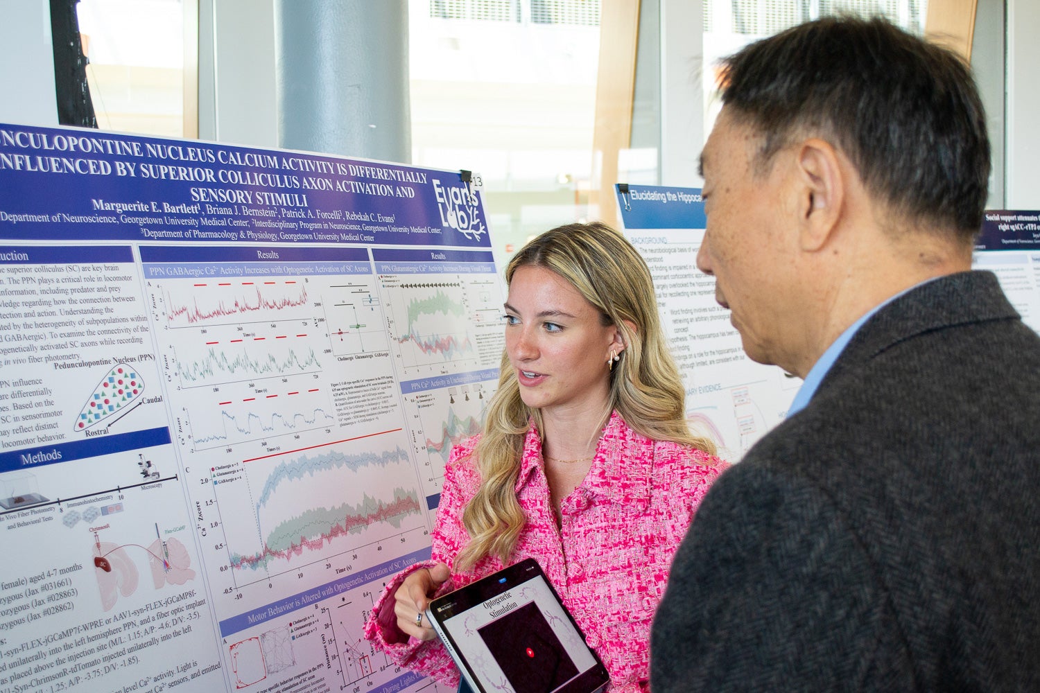 A student presents a research poster at Neuroscience Student Research Day