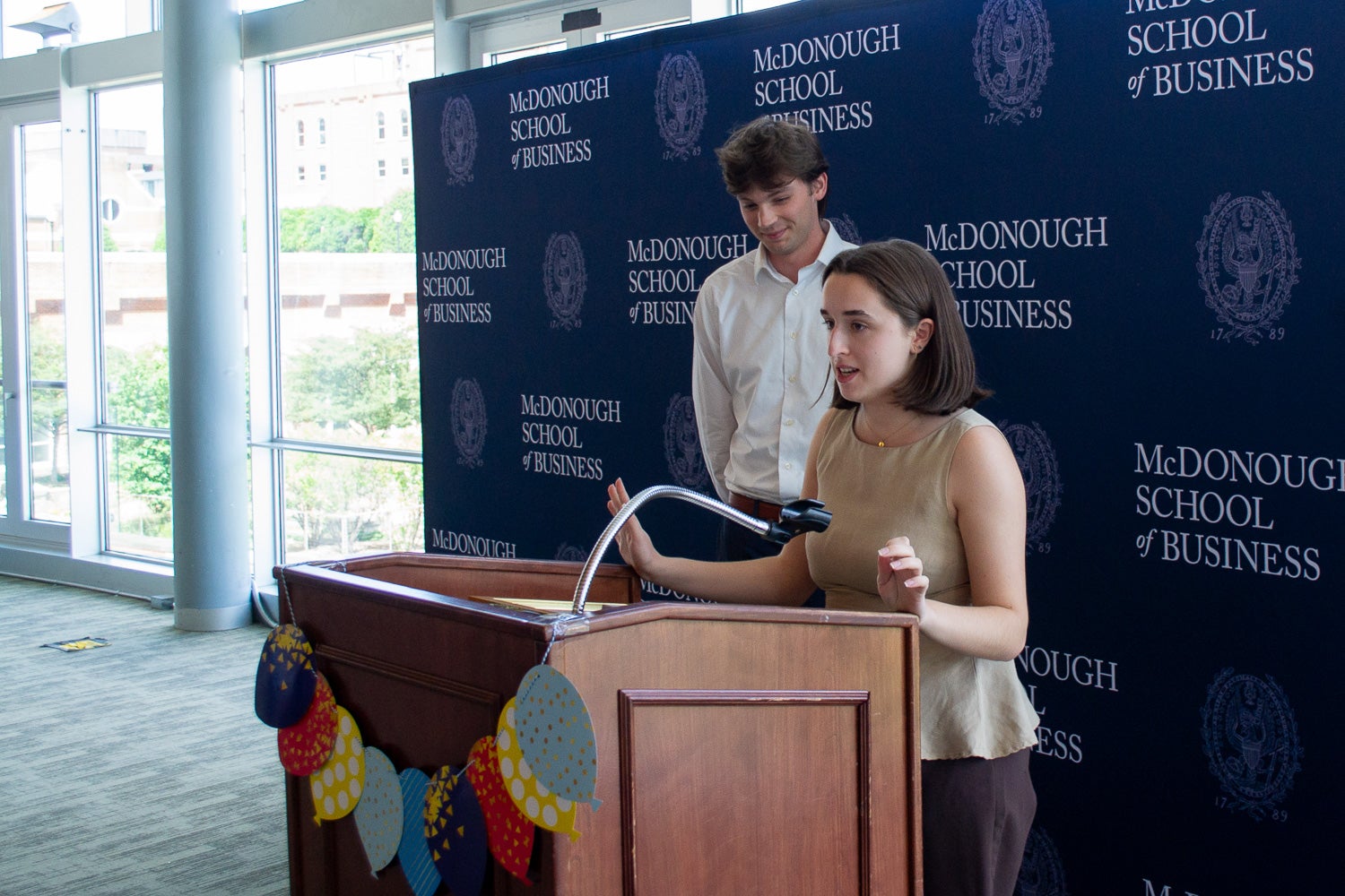 A student speaks from the podium at Neuroscience Student Research Day